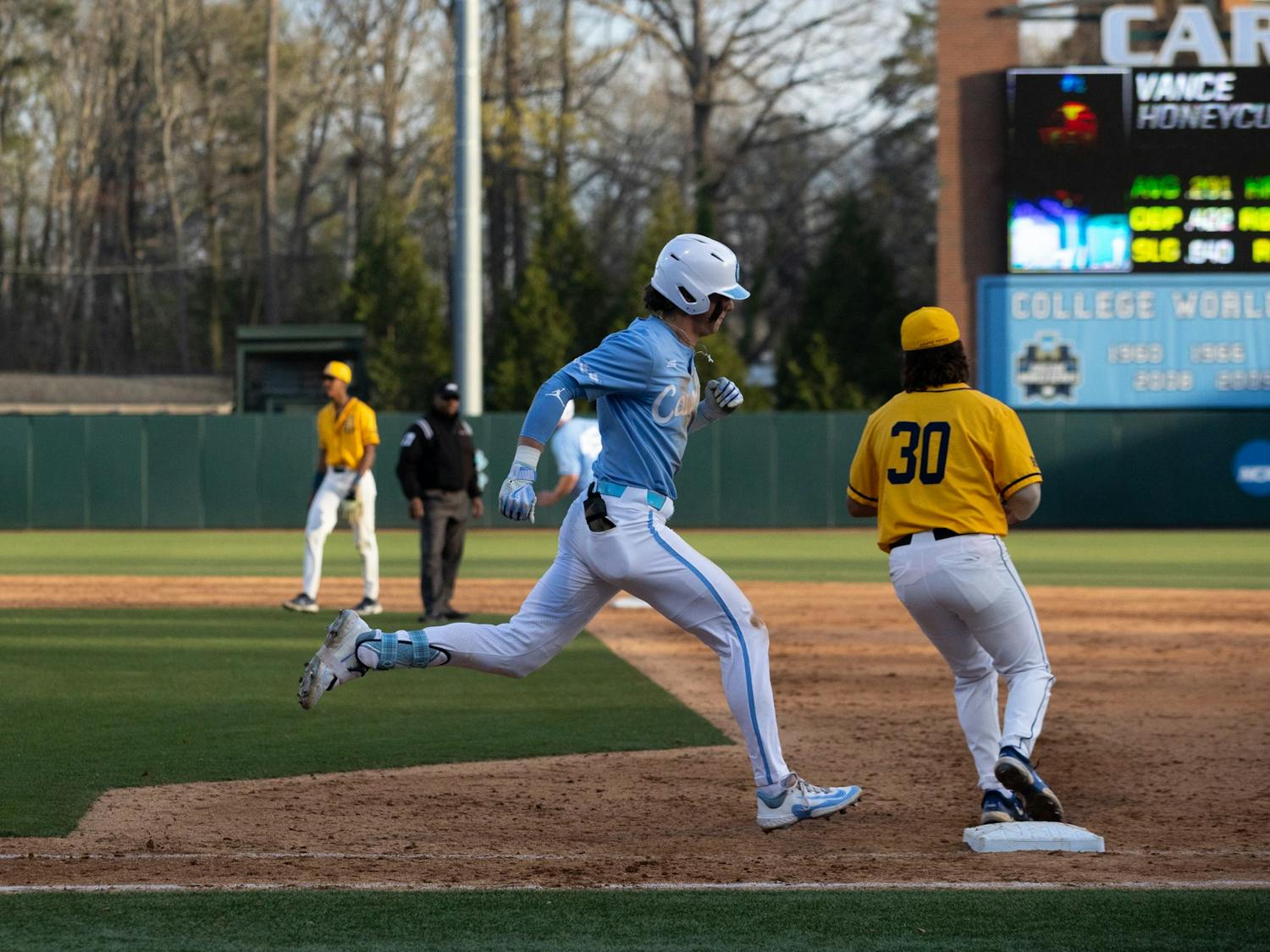 UNC sophomore Vance Honeycutt (7) arrives at first base during the baseball game against North Carolina A&amp;T on Tuesday, March 21, 2023, at Boshamer Stadium. UNC beat North Carolina A&amp;T 6-4.