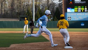 UNC sophomore Vance Honeycutt (7) arrives at first base during the baseball game against North Carolina A&amp;T on Tuesday, March 21, 2023, at Boshamer Stadium. UNC beat North Carolina A&amp;T 6-4.