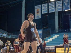 UNC senior Corey Daniel after winning his bout(3-2) against Virginia Tech in Carnmichael Arena on Friday, Feb. 8, 2019. Daniel's victory provided the points needed for UNC to further secure their lead and win the overall competition against Virginia Tech with a final score of 18-14.