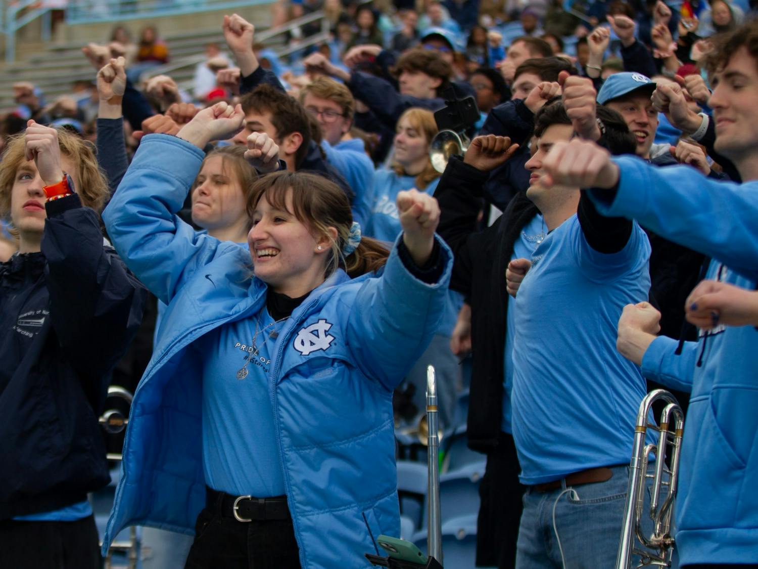 Members of UNC's Marching Tar Heels dance to a song during UNC football's spring scrimmage on April 9, 2022, in Chapel Hill, NC.