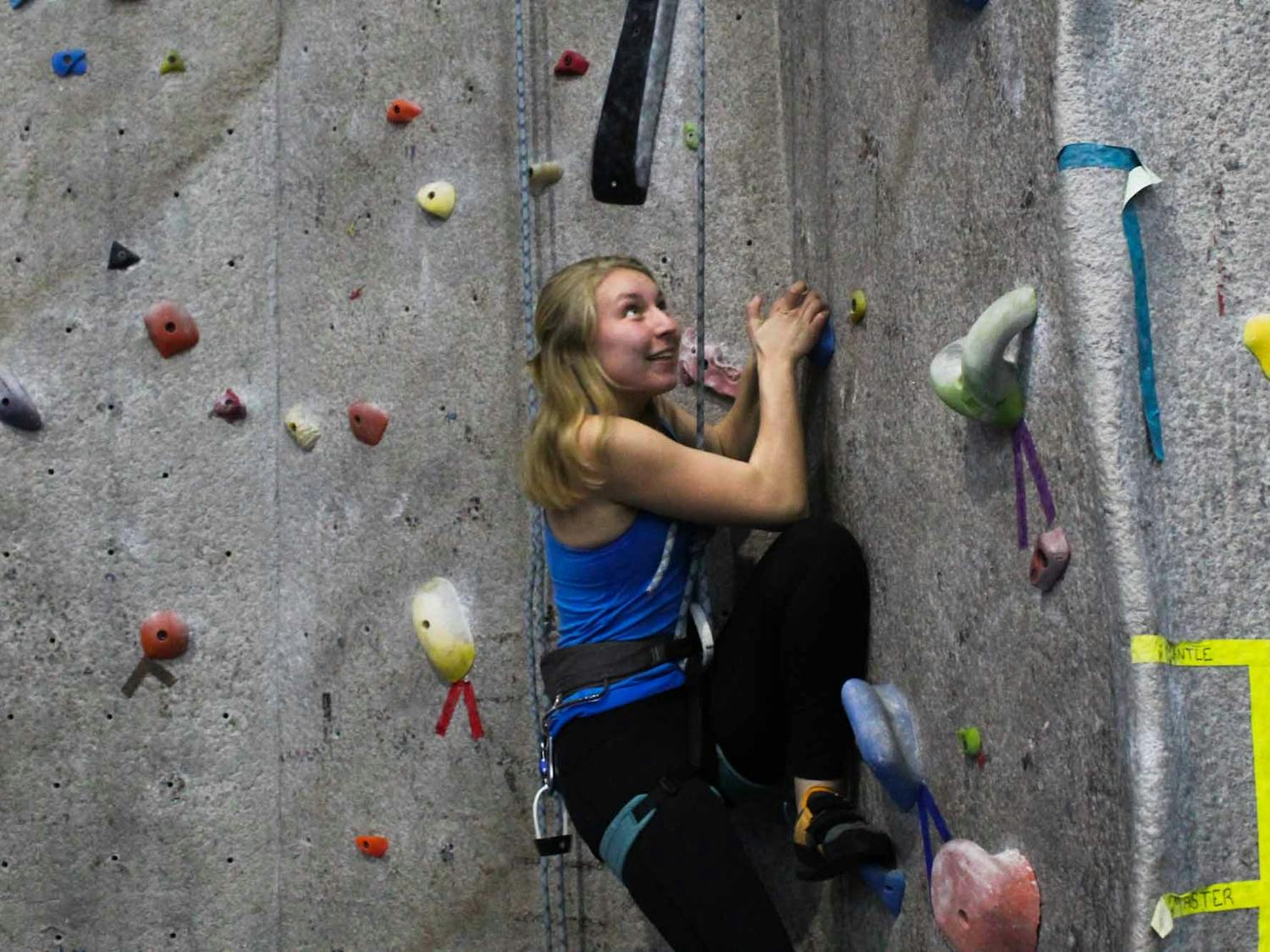 Anna Baechtold, a first-year art history major, practices rock climbing during practice on Thursday, Feb. 27, 2020 at Fetzer Gym C. "It's so literal and so easy to see your progress where in other sports, it's a bit more arbitrary," she said.
