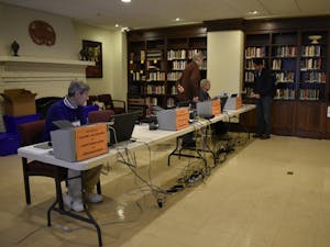 Volunteers prepare for voters at Chapel of the Cross, an early voting and Election Day voting location used by many UNC students.
