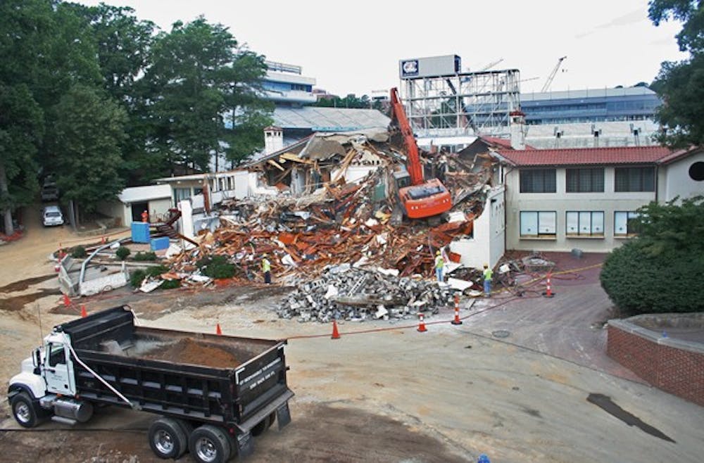 	Demolition crews tear down the Kenan Fieldhouse on June 8. DTH/Robert Turner Story