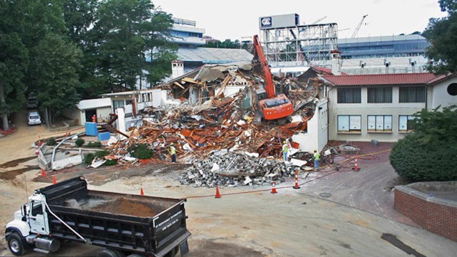 	Demolition crews tear down the Kenan Fieldhouse on June 8. DTH/Robert Turner Story