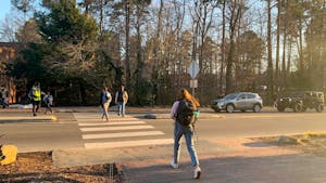 Students cross South road on the campus of the University of North Carolina at Chapel Hill on Jan. 25, 2022.