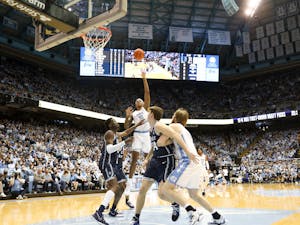 UNC junior forward Armando Bacot (5) puts up a shot from the paint during a UNC men's basketball game against Duke in the Dean Smith Center on Saturday, Feb. 5, 2022. Duke won 87-67.