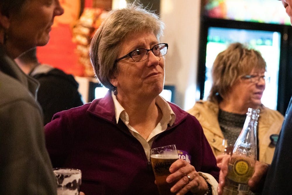 Carrboro mayoral candidate Lydia Lavelle attends a watch party hosted by alderman candidate Damon Seils' campaign at Steel String Brewery in Carrboro on Tuesday, Nov. 5, 2019.