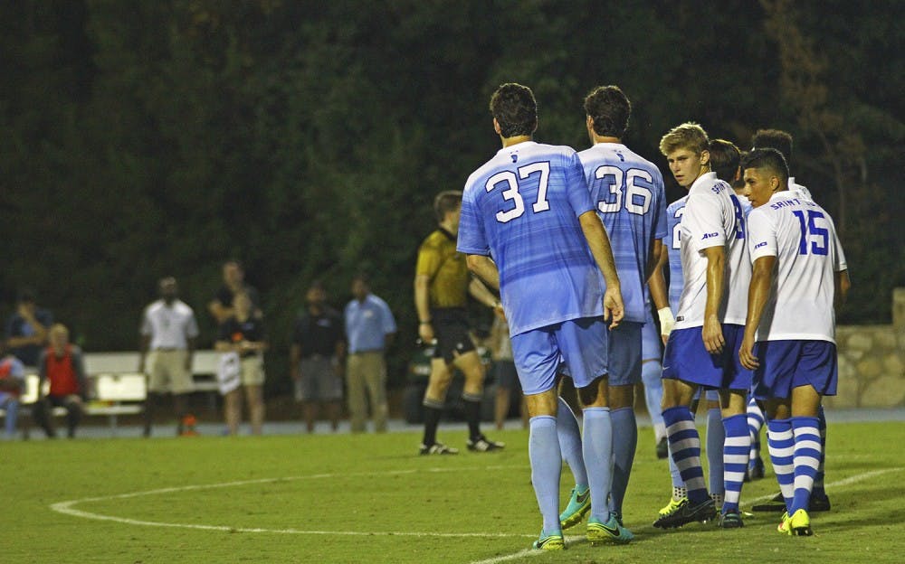 Redshirt seniors Walker and Tucker Hume line up for a free kick against St. Louis. The twins, from San Angelo, Texas, played their first game together for UNC against Cal Poly.