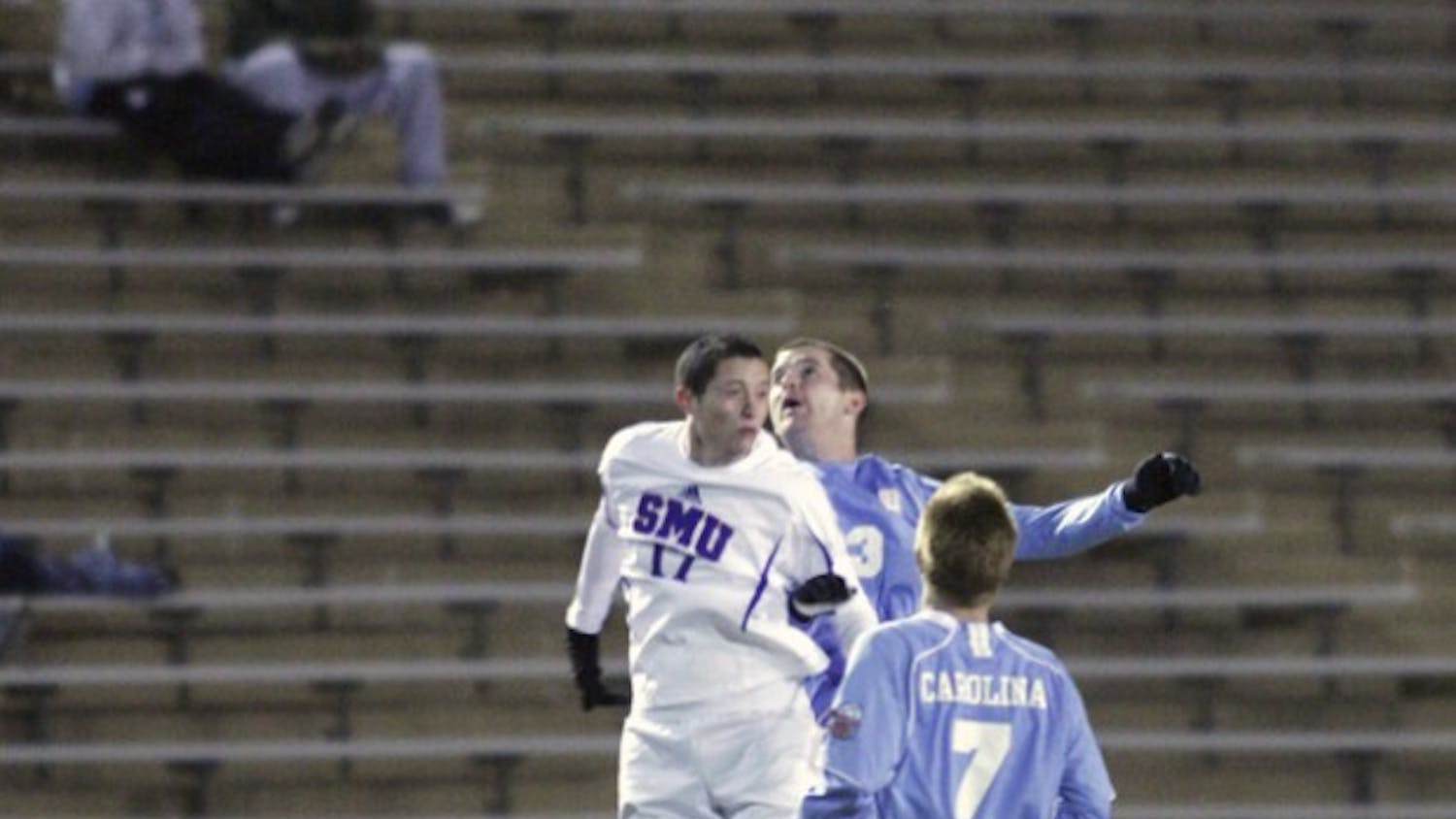 SMU’s Robbie Derschang goes for a header against Drew McKinney. Derschang was subject to a rowdy UNC crowd throughout the game.