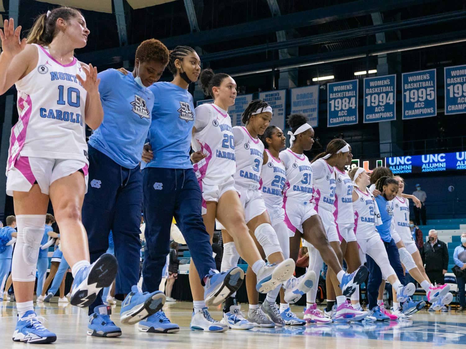 The women's basketball team sings the alma mater after the game against Miami on Feb. 6 in Carmichael Arena. The Heels won 85-38.