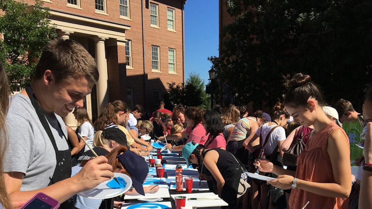 Students partake in "Paint a Picture of Your Carolina",&nbsp;a Week of Welcome event, led by the&nbsp;Wine & Design group.&nbsp;Photo Courtesy of Roslyn Sloop-Troutman.