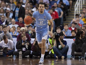 Then-first-year guard Cole Anthony (2) dribbles during the first-round of the ACC Tournament against Virginia Tech in the Greensboro Coliseum Complex on Tuesday, March 10, 2020. UNC beat Virginia Tech 78-56.