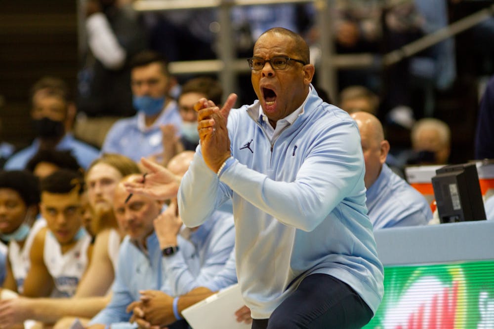 UNC basketball head coach Hubert Davis directs his team  during a home game against Michigan on Wednesday, Dec. 1, 2021. UNC won 72-51.