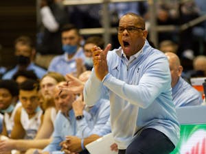 UNC basketball head coach Hubert Davis directs his team  during a home game against Michigan on Wednesday, Dec. 1, 2021. UNC won 72-51.