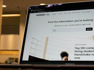 An open laptop inside of Davis Library displays the homepage of "Handshake", a site for students to discover job opportunities, on Sunday, Feb. 19, 2023.