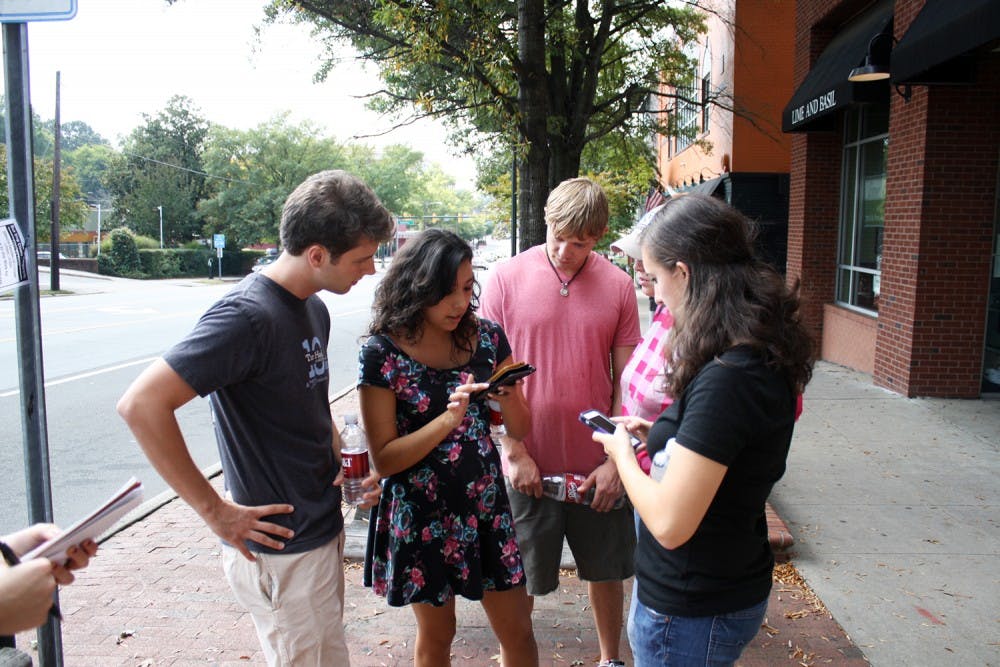 Team "Holding On (To The Glory Days)" assembles to come up with their strategy to win Love Chapel Hill's annual scavenger hunt on Saturday afternoon.