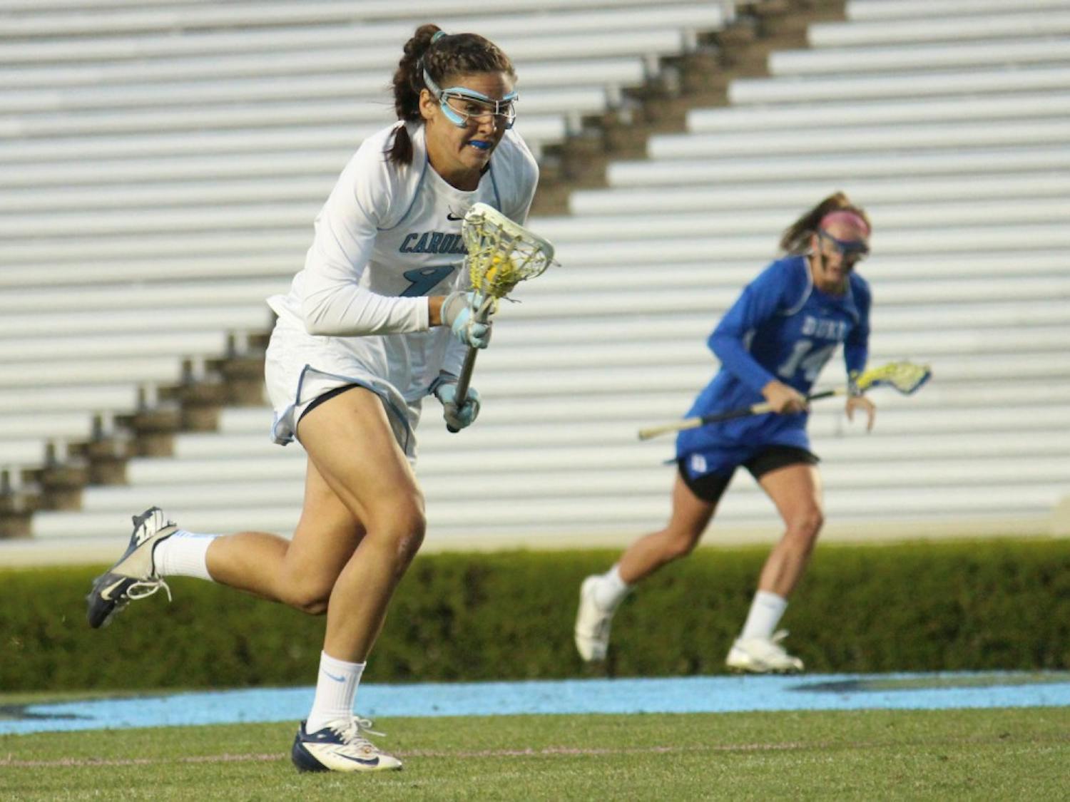 Women's lacrosse suffers a loss 7-6 to Duke in overtime on Wednesday in Kenan Stadium. No. 9 Margaret Corzel sprints downfield during the second half. 