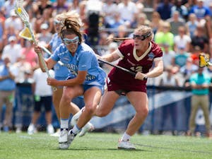 Senior midfielder Brooklyn Neumen (35) pushes past a defender during UNC's NCAA Tournament Championship Final against Boston College at Homewood Field in Baltimore, Md. on Sunday, May 29, 2022. UNC won 12-11.