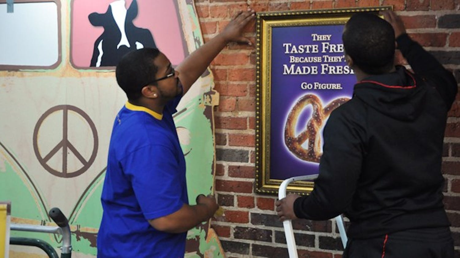 AUIYB - Owners Antonio McBroom (left) and Eric Taylor prepare for Ben and Jerry's Grand Re-Opening as well as Auntie Anne's addition Wednesday, January 11.
