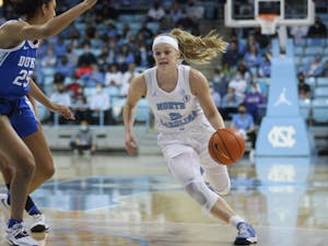 UNC graduate guard Carlie Littlefield (2) drives the ball into the paint during a home women's basketball game against Duke on Sunday, Feb. 27, 2022, at Carmichael Arena.
