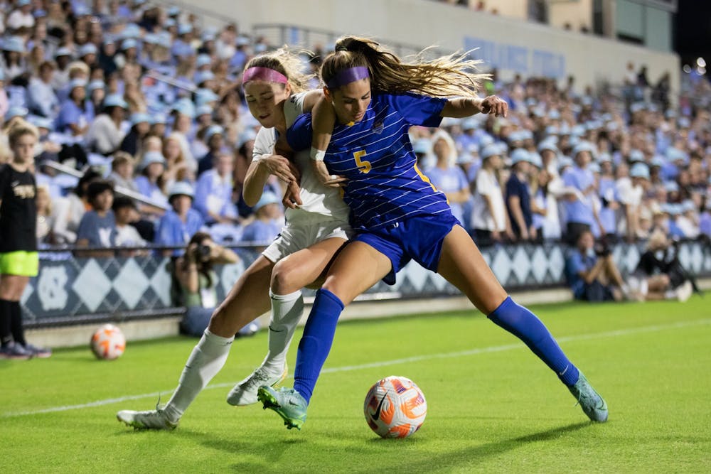 Senior forward Emily Moxley (8) tries to win back the ball during UNC's game against Pittsburgh at Dorrance Field on Oct. 6, 2022.