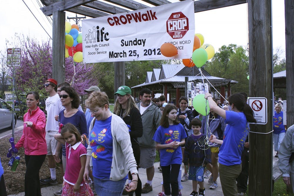 Participants kick off the IFC Crop Walk through Carrboro and Chapel Hill.