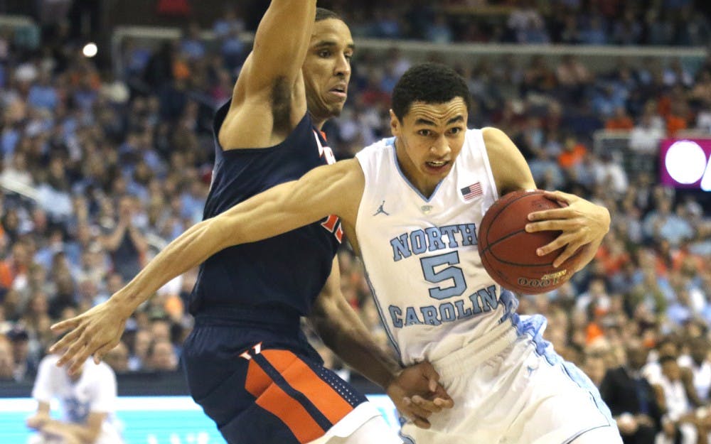 <p>UNC basketball player Marcus Paige (5) moves past Virginia’s Malcom Brogdon (15) during the ACC tournament in Washington, DC.</p>