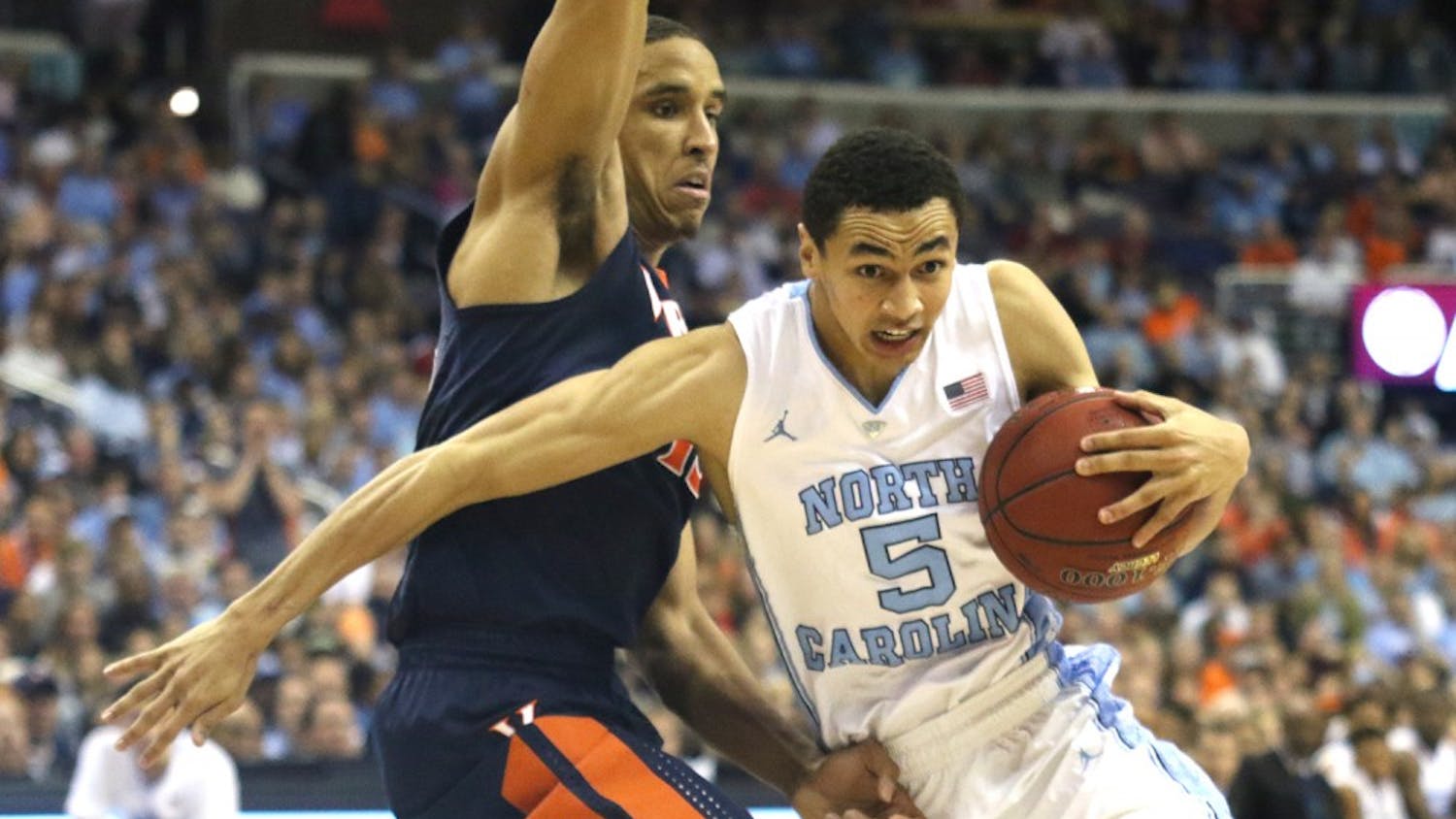 UNC basketball player Marcus Paige (5) moves past Virginia’s Malcom Brogdon (15) during the ACC tournament in Washington, DC.