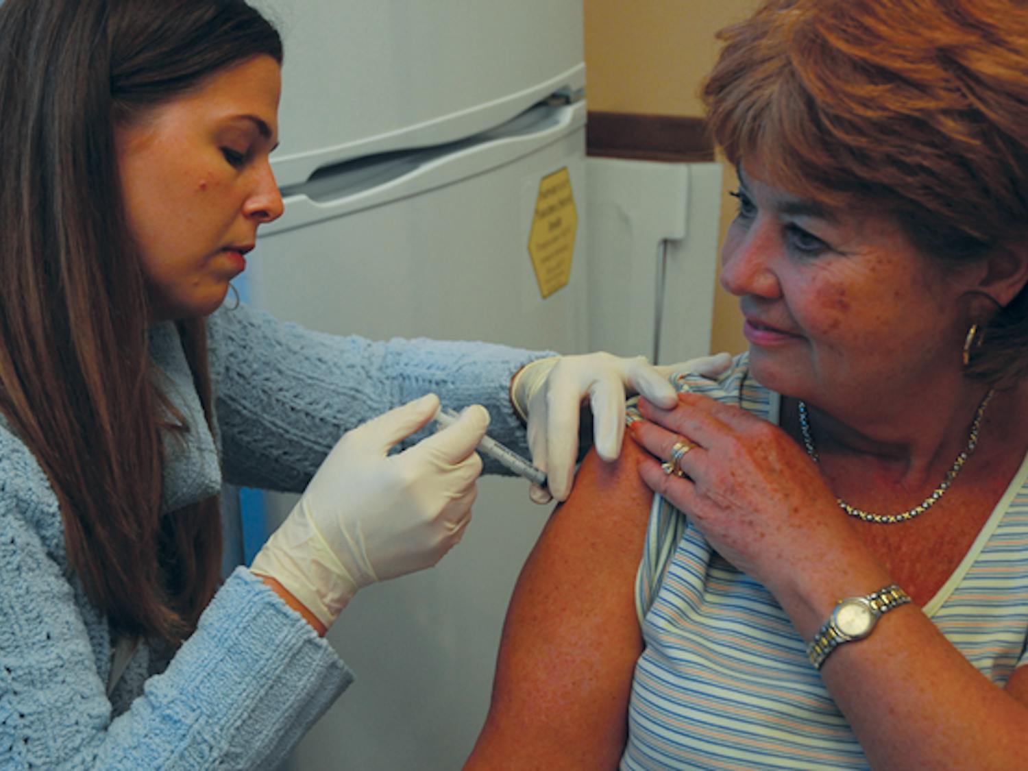 Pharmacist Lisa Adams Padgett administers the H1N1 vaccine to Beverly Dickinson at Kerr Drug in November. DTH/Lauren Vied