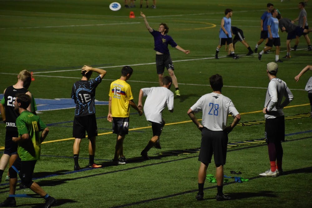 The club ultimate frisbee team holds their evening practice at Hooker fields on Sept. 18.