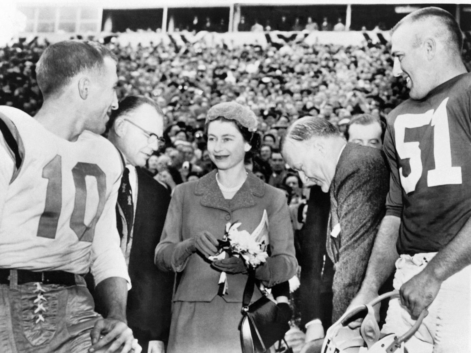 Queen Elizabeth II meets U.S. football players before a Maryland-North Carolina game in College Park, Maryland, during a visit to the United States on Oct. 21, 1957.
Photo Courtesy of International News Photos/AFP/Getty Images/TNS.