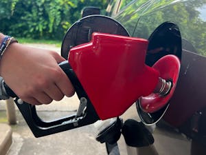 A person fills up their tank at a gas station on June 30, 2022. Gas prices in Chapel Hill have risen significantly over the past few months.