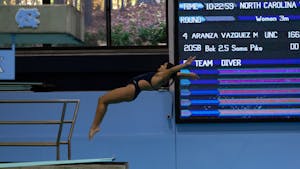UNC junior Aranza Vazquez dives during the UNC swim and dive meet against USC at Koury Natatorium on Saturday, Nov. 5, 2022.