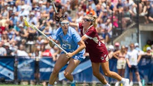 Junior midfielder Olivia Dirks (27) cradles the ball during UNC's NCAA Tournament Championship Final against Boston College at Homewood Field in Baltimore, Md. on Sunday, May 29, 2022. UNC won 12-11.