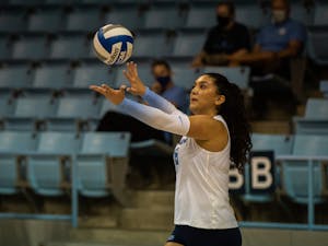 In the Sept. 18 game against Davidson, junior middle blocker Niki Khoshatefeh (6) serves the ball. UNC won three out of three sets.