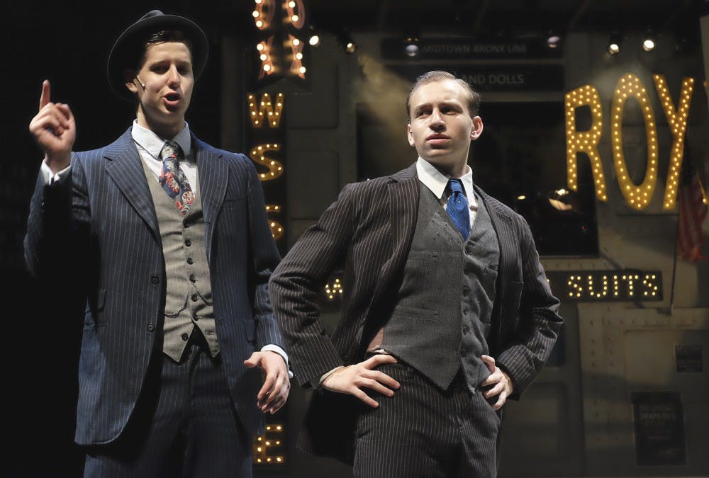 <p>Gideon Chickos (left) and Ethan Fox rehearse for the play "Guys &amp; Dolls," Tuesday evening.</p>