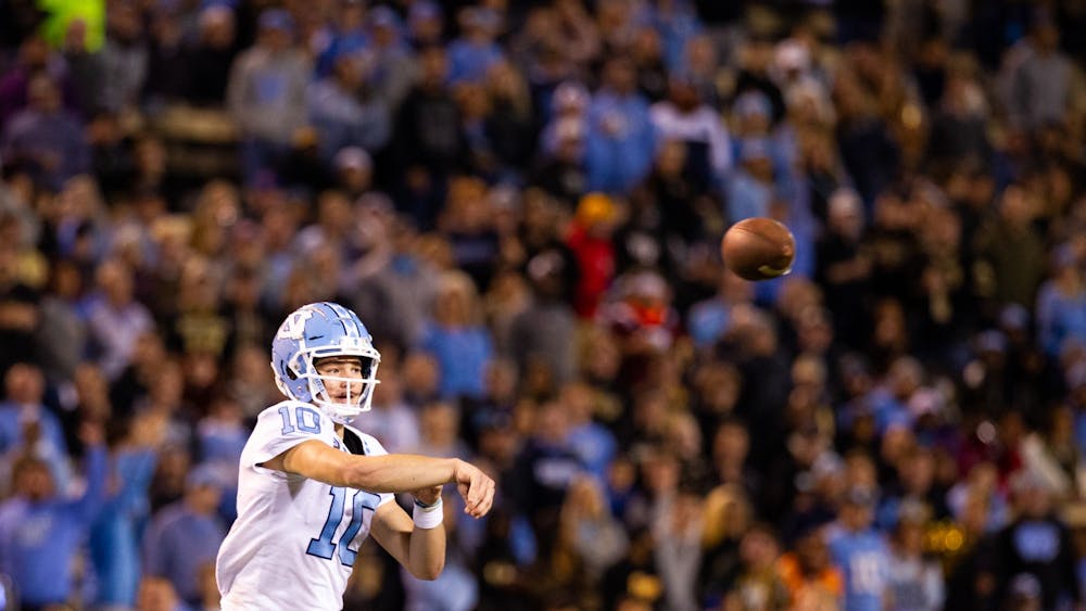 UNC red shirt first-year QB Drake Maye (10) passes the ball during UNC's match against Wake Forest at Truist Stadium on Saturday, Nov. 12, 2022. UNC won 36-34.