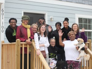 Marian Cheek Jackson Center staff and partners from Pee Wee Homes welcoming one of the center's newest Northside neighbors to the community. Photo courtesy of Hudson Vaughan. 