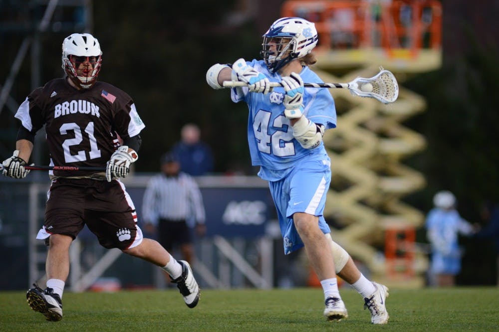 UNC Freshman Midfielder Spencer Parks (42) passes the ball to a teammate.