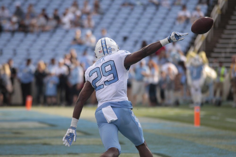 First-year defensive back Storm Duck celebrates after scoring a touchdown during the spring football game in Kenan Memorial Stadium on April 13, 2019. 