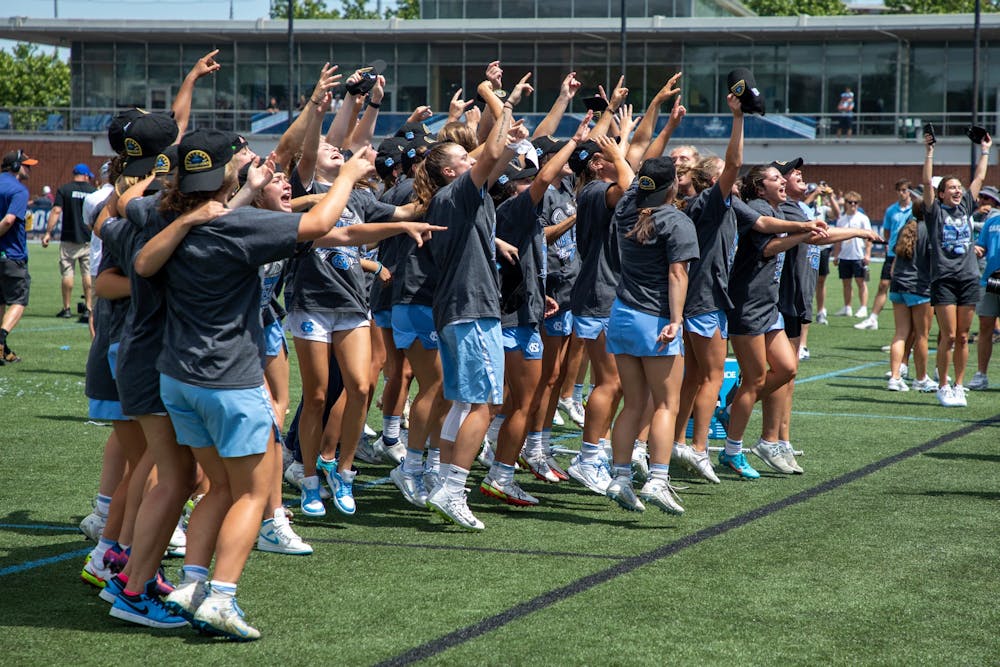 Members of the UNC women's lacrosse team celebrate their NCAA Tournament championship victory. UNC beat Boston College 12-11 at Homewood Field in Baltimore, Md. on Sunday, May 29, 2022.
