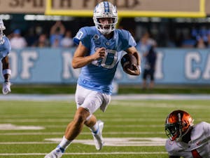 Redshirt first-year quarterback Drake Maye (10) runs the ball at the first home game of the season versus Florida A&amp;M at Kenan Stadium on Aug. 27. The Heels are up 28-14 at the half.