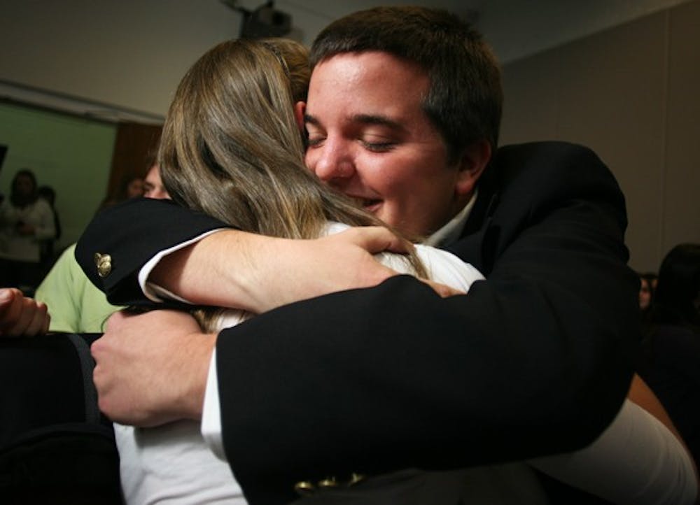 Hogan Medlin celebrates his overwhelming victory Tuesday with Michelle Healy, one of his campaign managers. DTH/Andrew Johnson