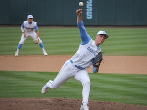 UNC senior pitcher Shawn Gage Gillian (15) pitches the ball during the Tar Heels' 1-6 loss against N.C. State on Saturday, March 27, 2021 in Boshamer Stadium in Chapel Hill, N.C.