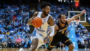 Senior forward Leaky Black (1) dribbles the ball at the game against Appalachian State on Dec 21, 2021 at the Dean E. Smith Center. UNC won 70-50.