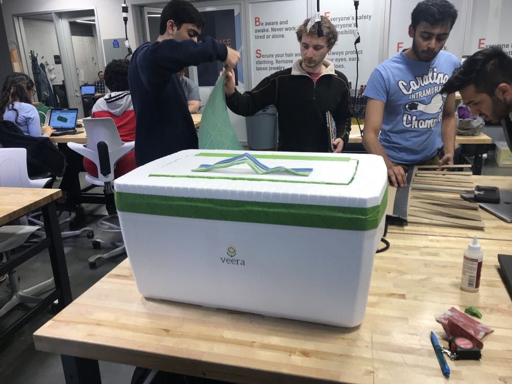 <p>Students build cold storage units designed by the startup, Veera. Photo courtesy of Varun Jain.&nbsp;</p>