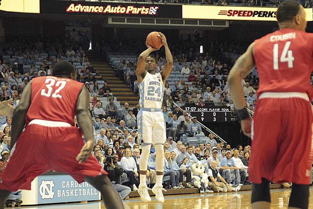 UNC guard Kenny Williams (24) pulls up for a three-point shot against Radford on Sunday. 