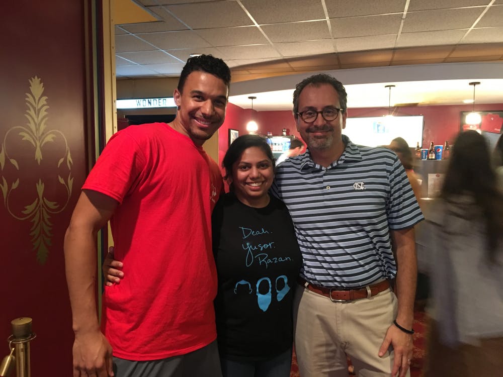 <p>Jordan Sawyers, Kaushal Ghandi and School of Dentistry Dean Scott De Rossi pose at the Varisty Theatre at a talent show in honor of Yusor Mohammad Abu-Salha, &nbsp;Deah Shaddy Barakat and &nbsp;Razan Mohammad Abu-Salha.&nbsp;</p>
