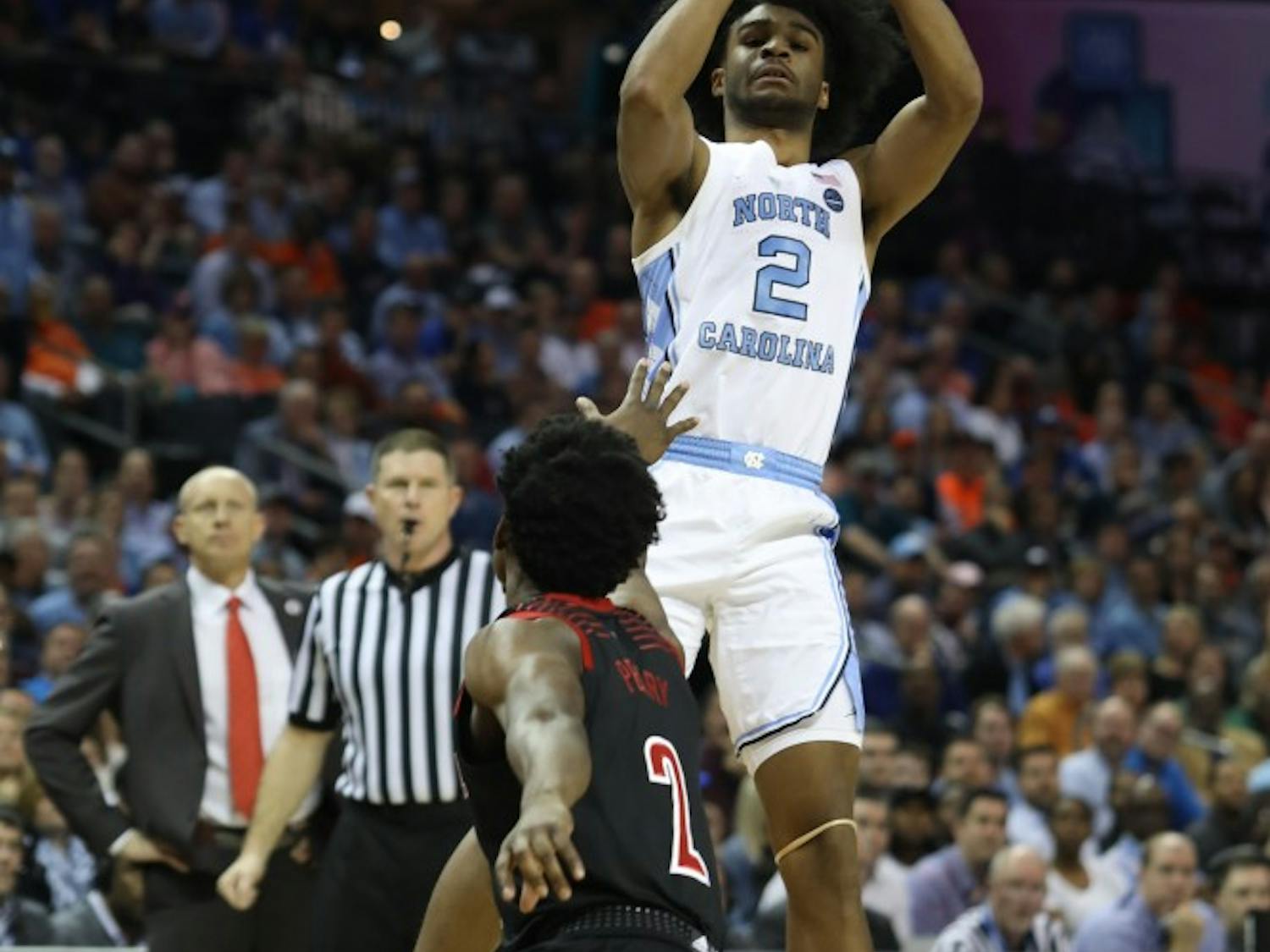 First-year guard Coby White (2) shoots a three-pointer against Louisville in the quarterfinals of the ACC tournament on Thursday, March 14, 2019 at the Spectrum Center in Charlotte, N.C. UNC defeated Louisville 83-70 to advance to the semifinals. 