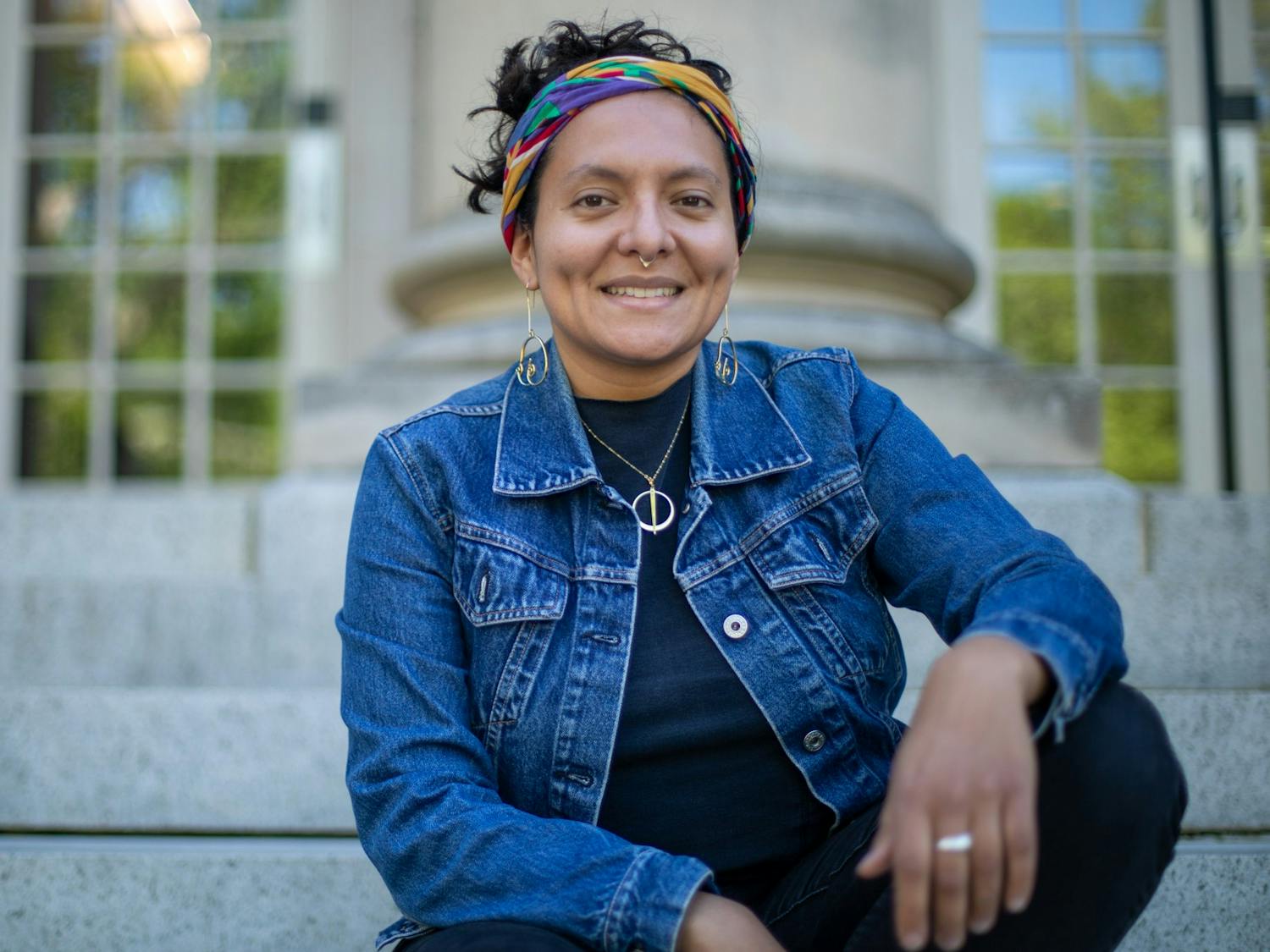 Alex M. Sanchez, 29, poses in front of Carroll Hall on Tuesday, April 19, 2022. Sanchez plans to use the grant money she has won to tell the story of her family's immigration from Nicaragua to the U.S. in 1985. "Our country is made up of immigrants," said Sanchez, "and I'm excited to see my aunt and my mom tell their story."